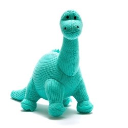 Knitted diplodocus dinosaur soft toy in ice blue colour with long neck and tail and smiley face